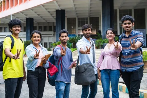 there are six students who wore the bag and showing the victory sign